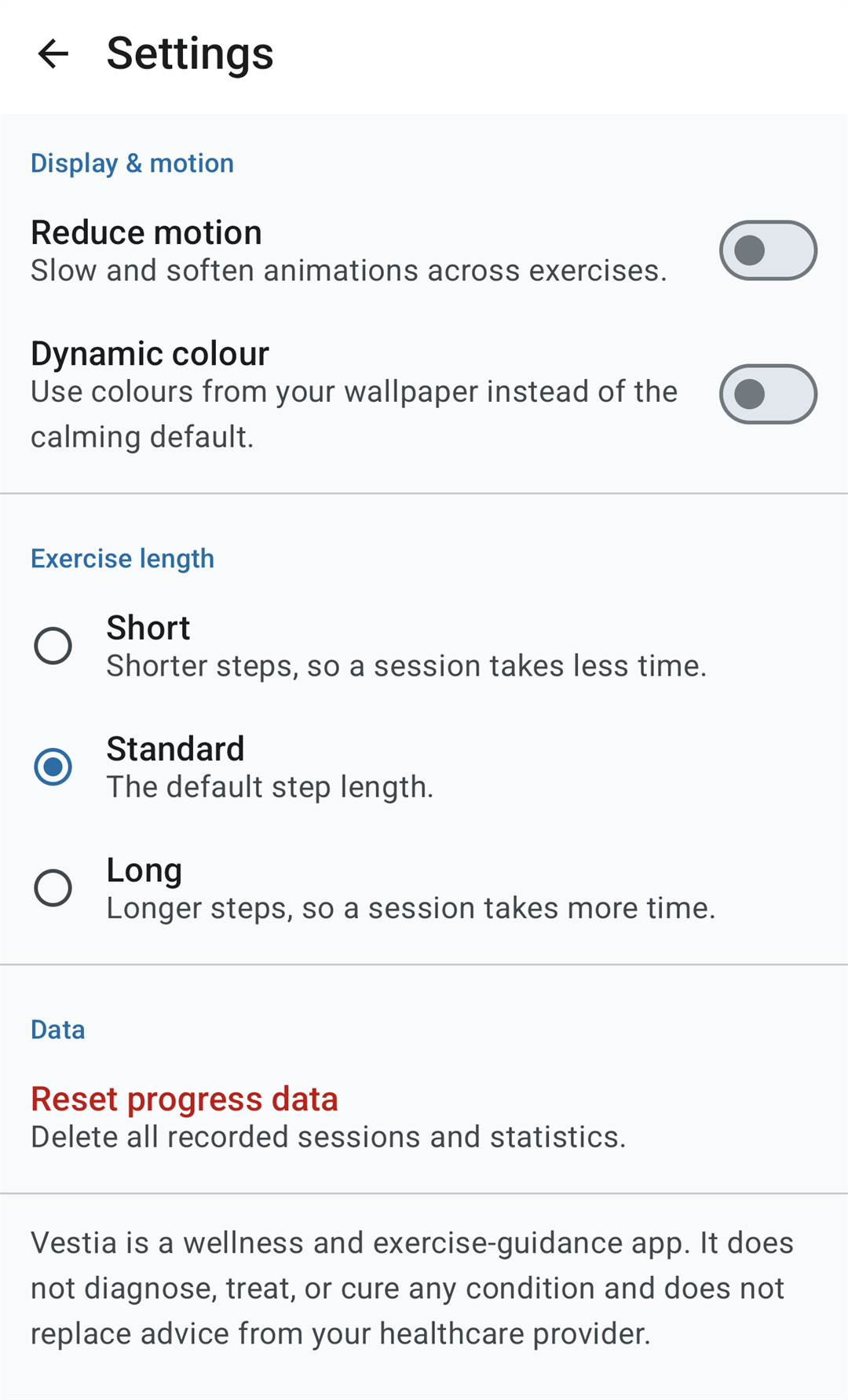 Vestia Settings screen with a Display and motion section containing Reduce motion and Dynamic colour toggles, an Exercise length section offering Short, Standard and Long, a Data section with Reset progress data, and the disclaimer that Vestia does not diagnose, treat or cure any condition.